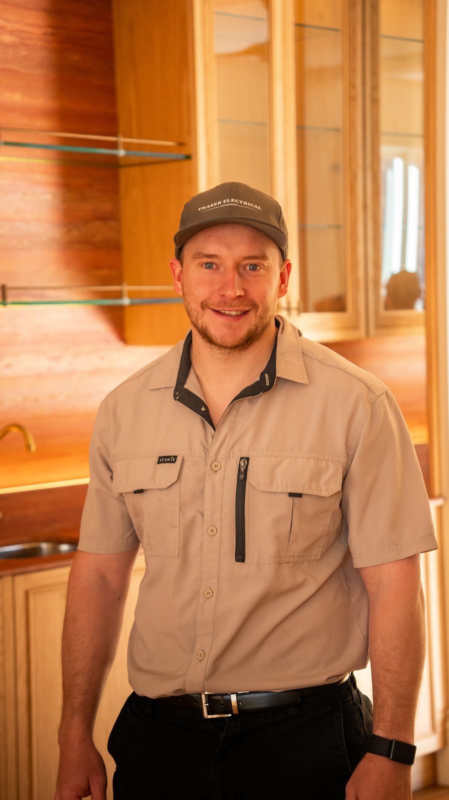 Fraser Electrical technician on site in a finished kitchen