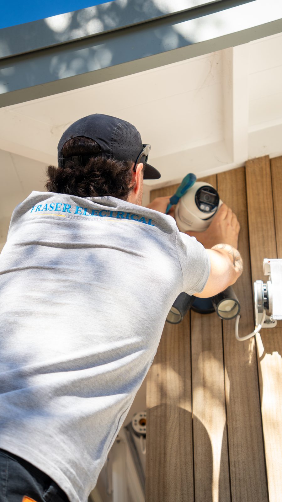 Fraser Electrical technician installing an external unit