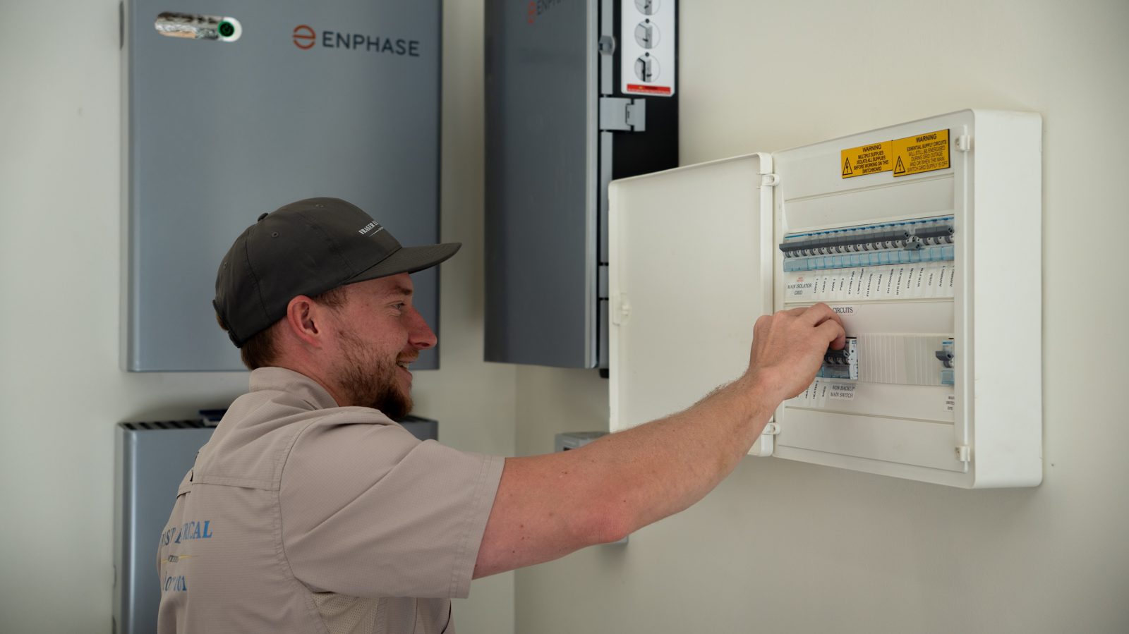 Fraser Electrical technician working on a switchboard